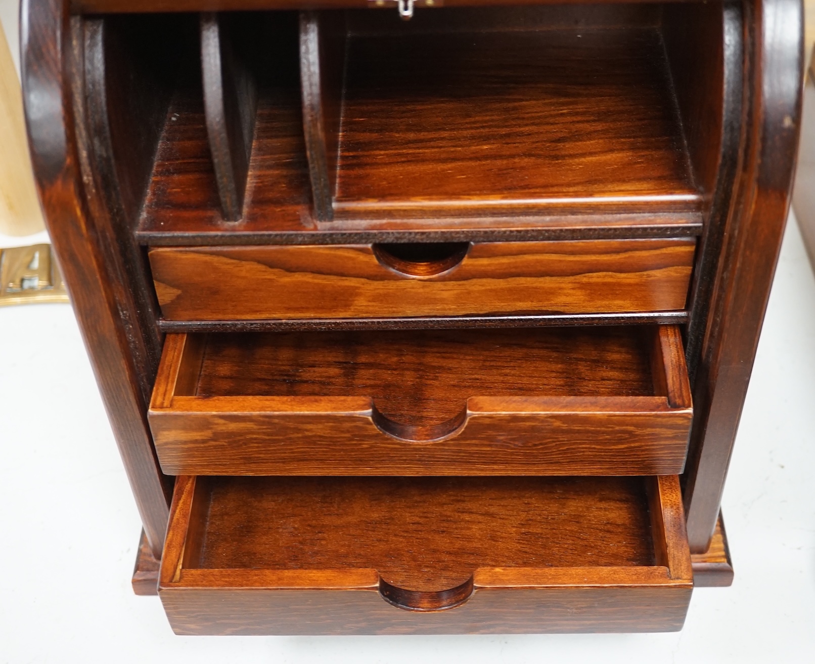 A tambour fronted stationery rack, 30cm high. Condition - fair